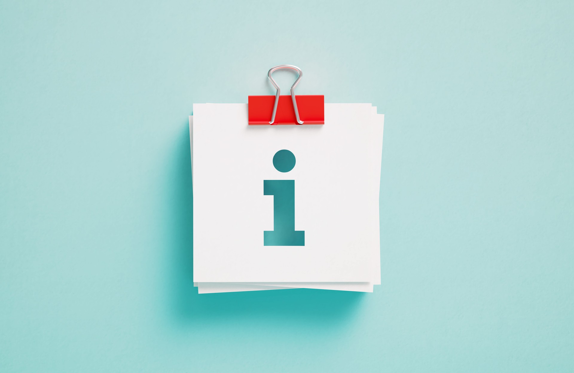 Information Symbol Written Post It Notes Held By A Paper Clip On Blue Background