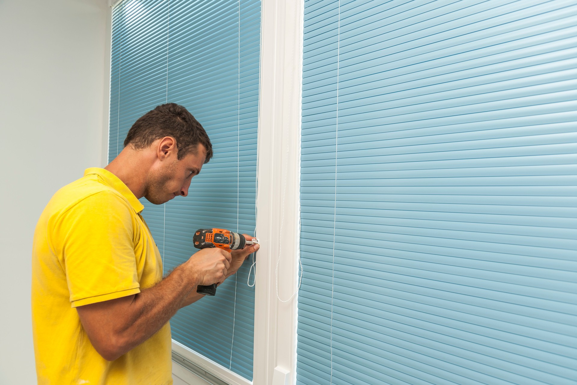 Handyman during Home Renovation Finishing Balcony Windows